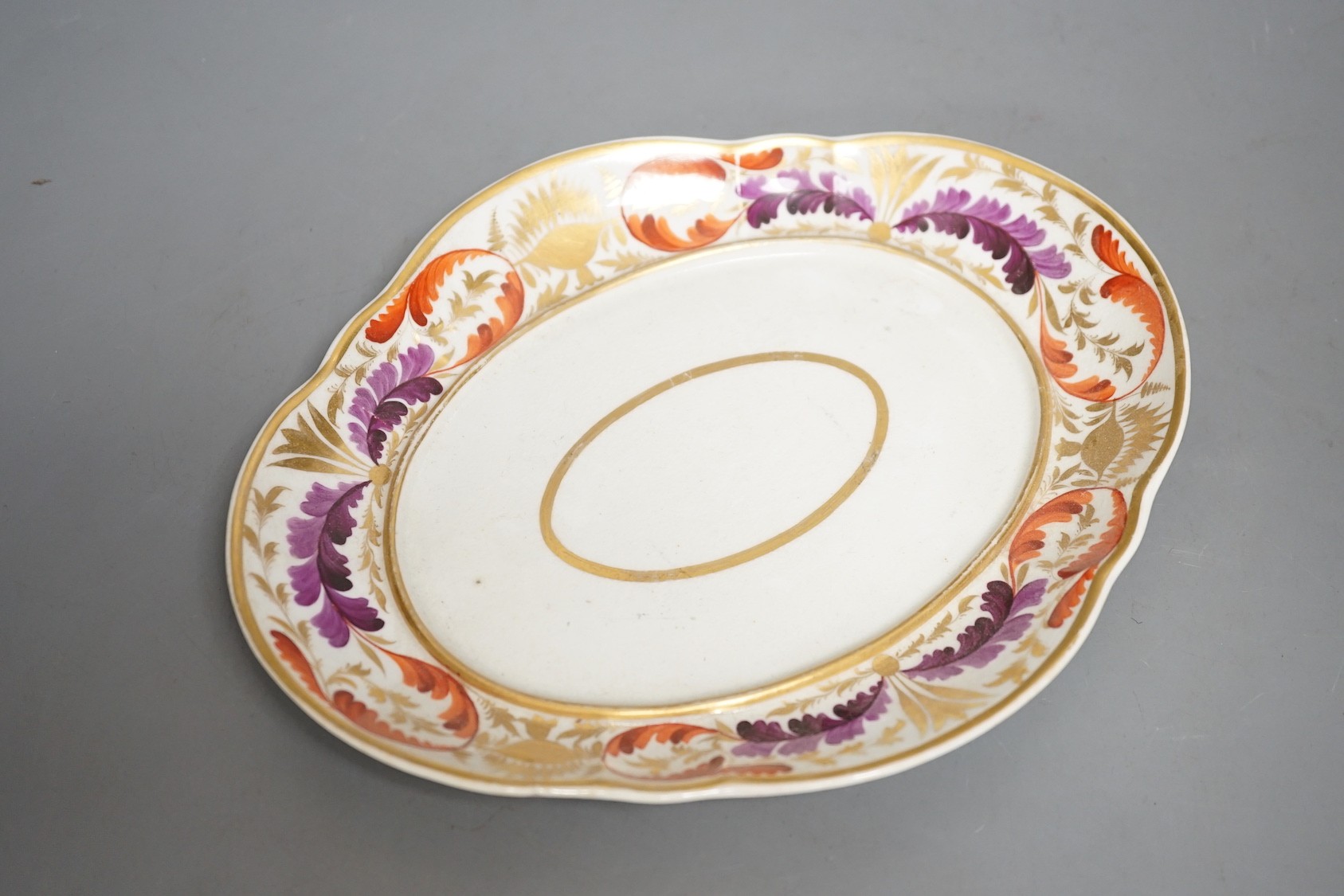 A small Derby tureen cover and stand, c.1825, 22 cm wide, and an English porcelain floral ice pail and cover (lacking liner)